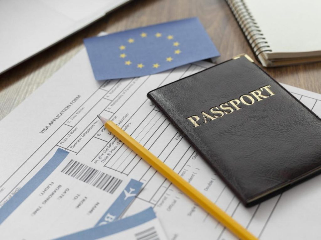 Essential documents for renting a property in the UK including passport, visa application form, and flight tickets